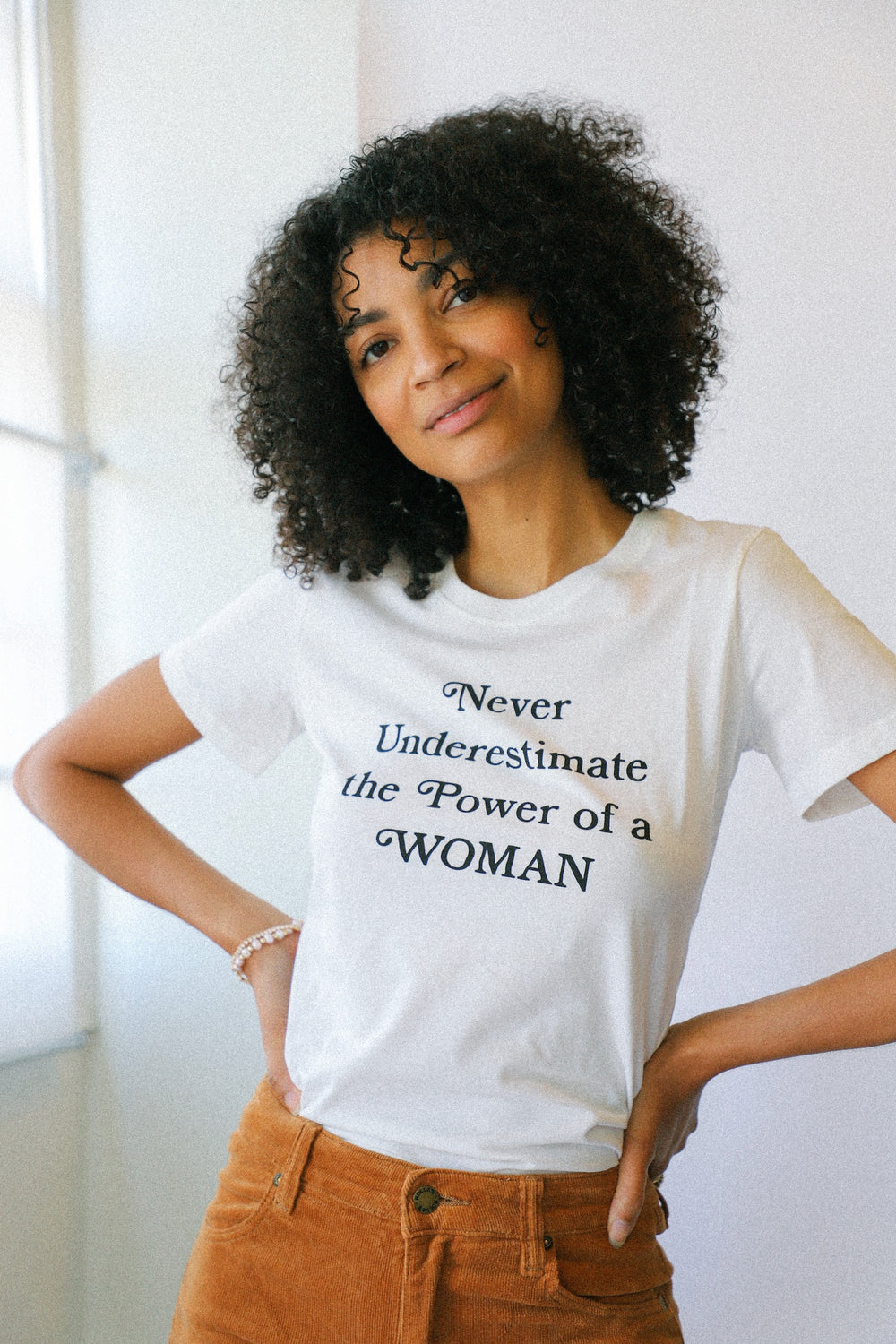 Never Underestimate Woman Tee